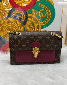 LOUIS VUITTON monogram burgundy leather victorie gold hardware