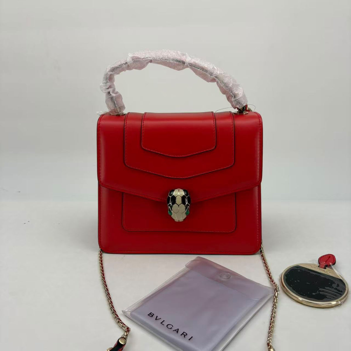 Bulgari Orange-Red Serpenti Top Handle, Raincoat, Mirror